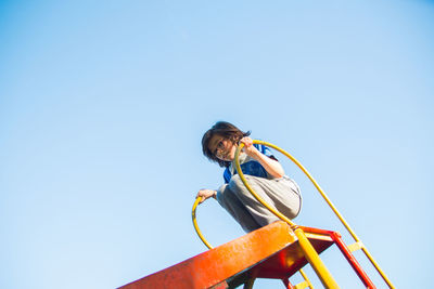 Children about to slide in playground