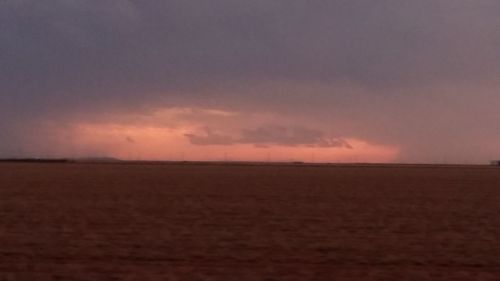 Scenic view of sea against sky at sunset