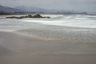 Scenic view of beach against sky