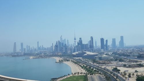 Panoramic view of buildings in city against clear sky