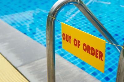 High angle view of information sign at swimming pool