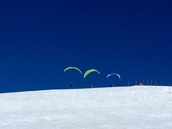 Kite against blue sky during winter