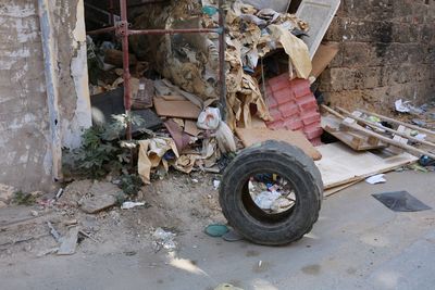 Abandoned vintage car against building