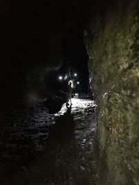 People in cave at night during winter