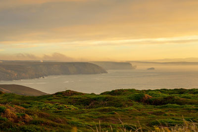 Scenic view of sea against sky during sunset