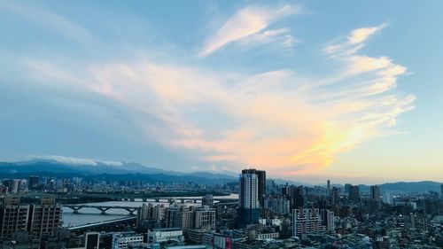 High angle view of buildings against sky during sunset