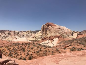 Rock formations in desert against clear sky