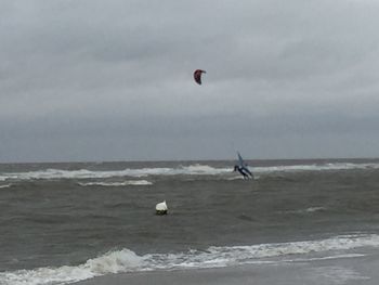 People surfing on beach