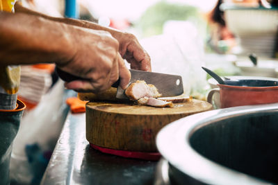 Cropped hands of person preparing food