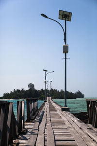 Empty street light against clear sky