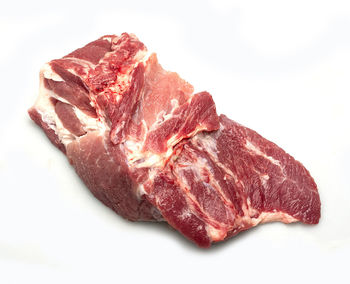 Close-up of meat against white background