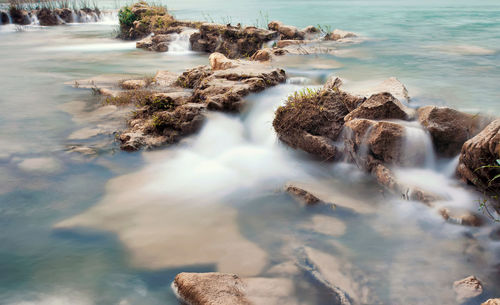 Panoramic view of rocks on sea shore