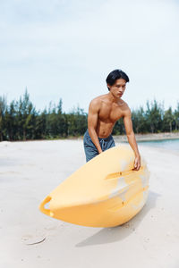 Side view of man exercising in sea