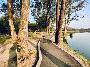 Road by lake against sky