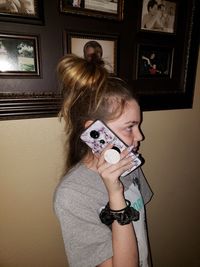 Portrait of woman holding girl at home