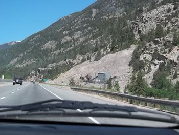 Country road leading towards mountains