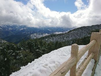 Scenic view of snowcapped mountains against sky