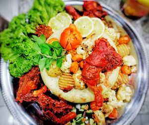 High angle view of fruit salad in plate on table