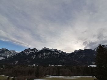 Scenic view of snowcapped mountains against sky