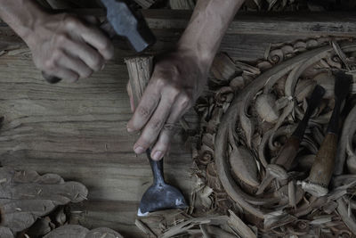 Cropped image of carpenter working in carpentry workshop