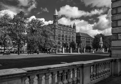 View of buildings against cloudy sky