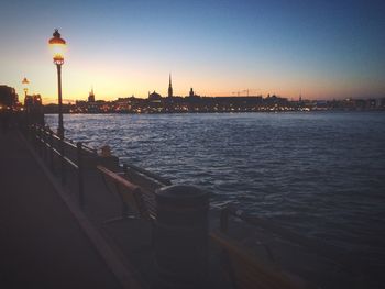 Illuminated city at sunset