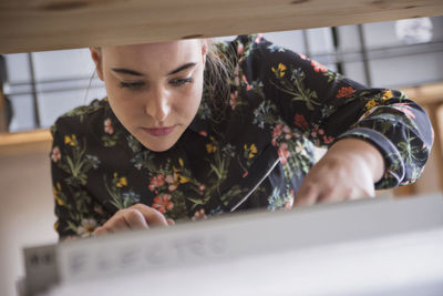 Young woman shopping for records