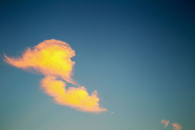 Low angle view of vapor trail in blue sky