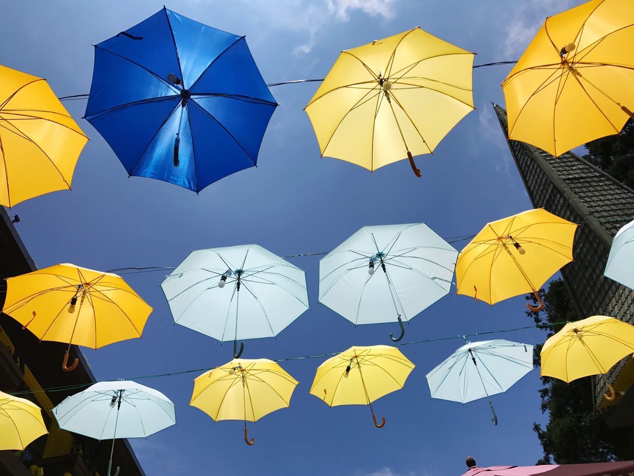 LOW ANGLE VIEW OF YELLOW UMBRELLA