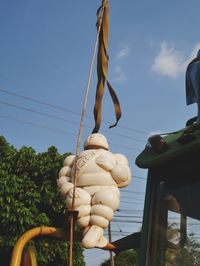 Low angle view of statue against sky