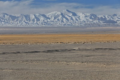 Scenic view of snowcapped mountains against sky