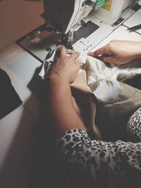 Low section of woman working in workshop