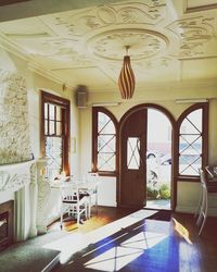 Empty chairs and table in building