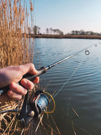 Cropped hand of man holding water