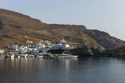 Sailboats at folegandros harbour against clear sky