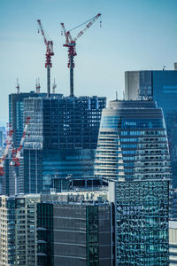 Low angle view of skyscrapers against clear sky