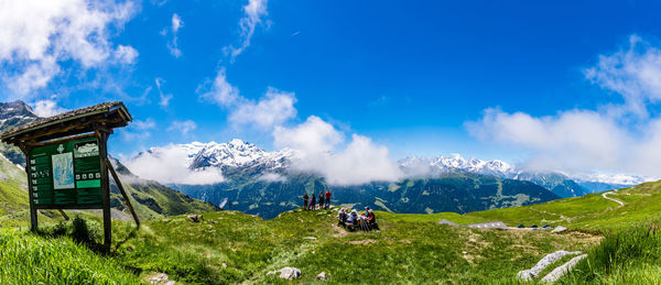 Scenic view of landscape against cloudy sky