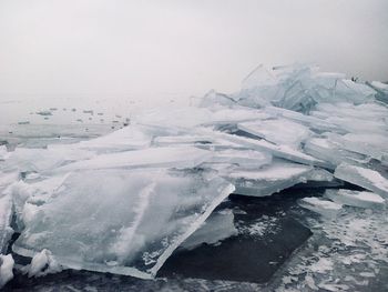 Scenic view of frozen sea against sky