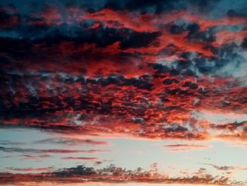 Low angle view of dramatic sky during sunset