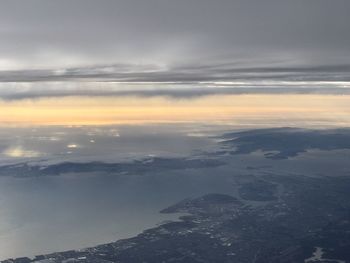 Aerial view of landscape against sky during sunset