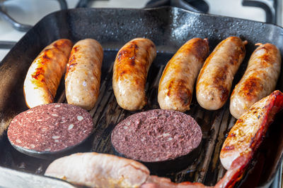 High angle view of meat on barbecue grill