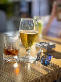 Close-up of beer glass on table