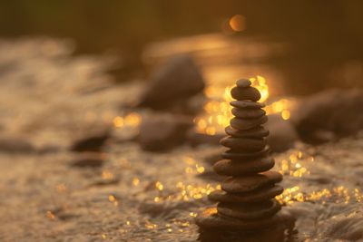 Close-up of chess pieces on pebbles