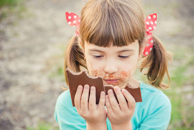 Close-up of cute girl looking away