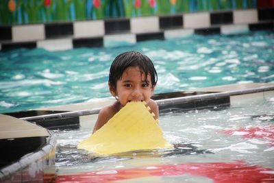 Portrait of a boy swimming in pool