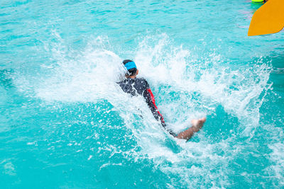 High angle view of boy splashing water in park