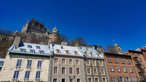 Low angle view of building against clear blue sky