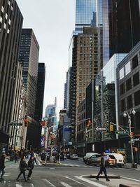 City street and modern buildings against sky