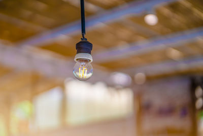 Low angle view of illuminated light bulb