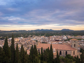 Townscape against sky during sunset